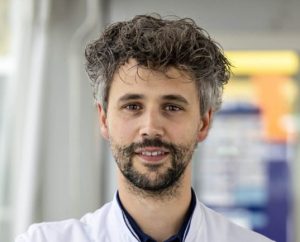 Dr. Jules Derks standing in medical uniform